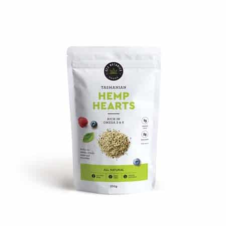 White packet of tasmanian hemp hearts with green text and photo of hemp seeds