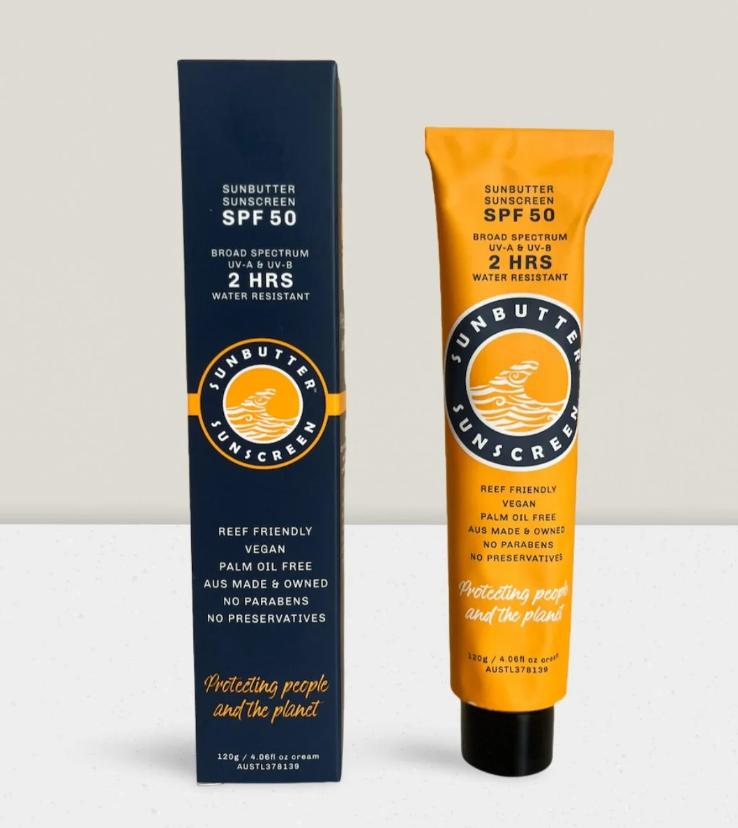 Blue box and orange metal tube of sunbutter sunscreen.